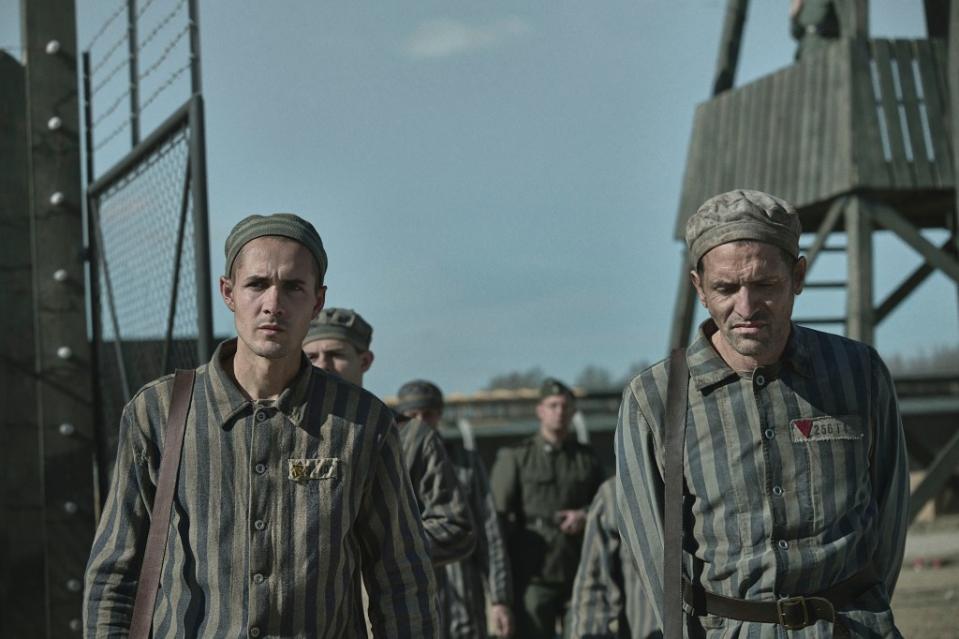 THE TATTOOIST OF AUSCHWITZ — Episode 101 — Pictured: (l-r) Jonah Hauer-King as Lali Sokolov, Adam Karst as Pepan in Auschwitz — (Photo by: Martin Mlaka/Sky UK)