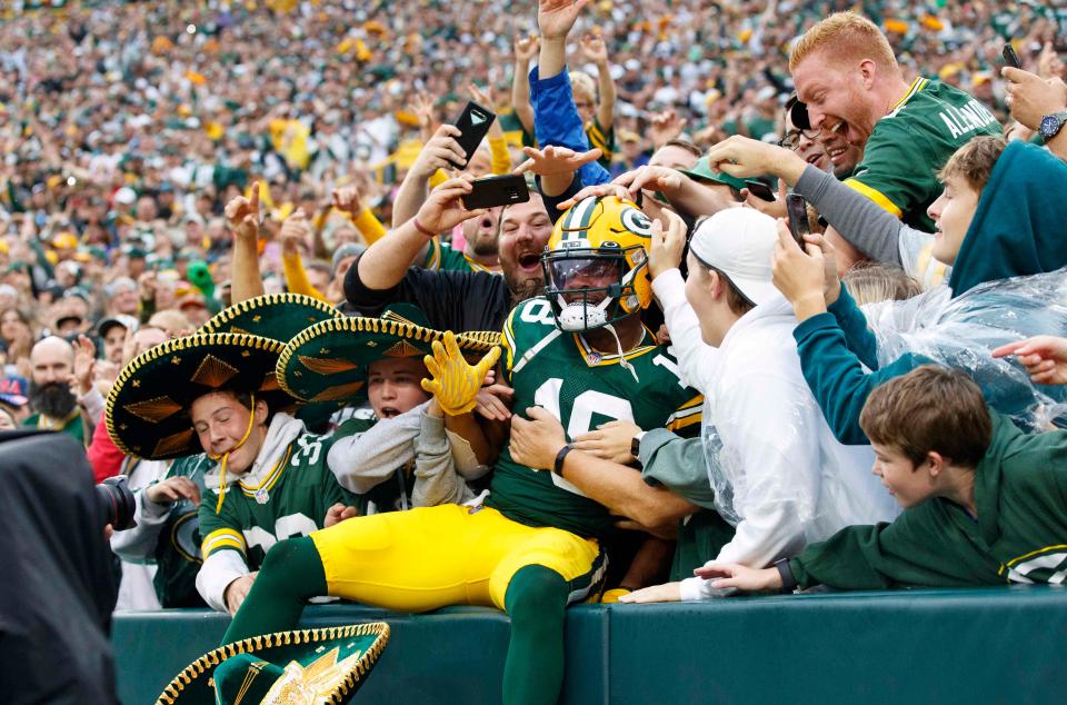 Green Bay Packers wide receiver Randall Cobb (18) celebrates a touchdown by jumping into the stands for a Lambeau Leap during the second quarter against the Pittsburgh Steelers at Lambeau Field.