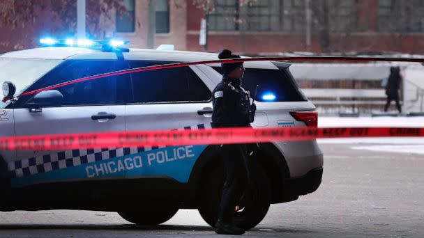 PHOTO: Chicago police secure a crime scene on the campus of Benito Juarez Community Academy high school in Chicago where four people were shot after school, Dec. 16, 2022. (Chicago Tribune/TNS via Getty Images)