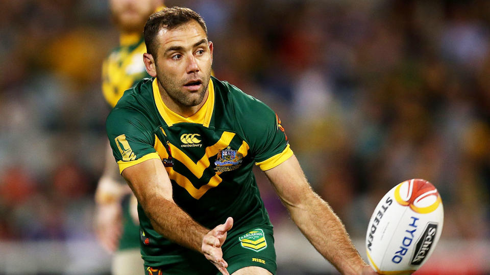 In this picture, Cameron Smith throws a pass while playing for Australia.