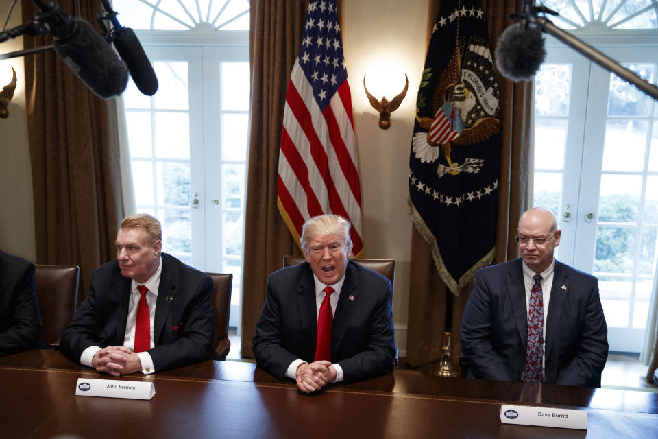 FILE - In this March 1, 2018, file photo, President Donald Trump speaks during a meeting with steel and aluminum executives in the Cabinet Room of the White House in Washington, with Nucor's John Ferriola, left, and Dave Burritt of U.S. Steel Corporation. Hundreds of companies have been granted permission to import millions of tons of steel made in China, Japan and other countries without paying the hefty tariff Trump put in place. (AP Photo/Evan Vucci, File)