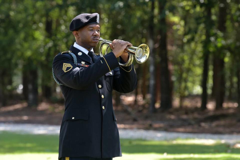 Staff Sgt. Nicolas Johnson plays “Taps”at the end of the interment ceremony for retired Staff Sgt. Robert J. Wolfenberger Jr. at Ft. Mitchell National Cemetery in Ft. Mitchell, Alabama on Wednesday morning. 07/05/2023