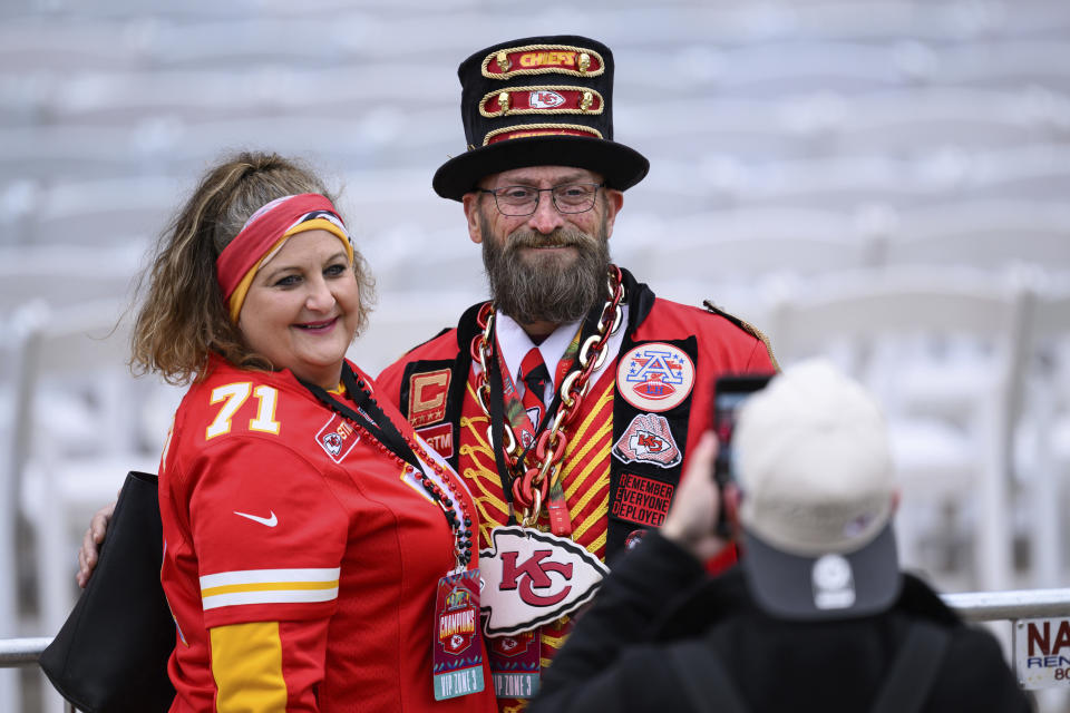 Fans pose for a photo during the Kansas City Chiefs' victory celebration and parade in Kansas City, Mo., Wednesday, Feb. 15, 2023. The Chiefs defeated the Philadelphia Eagles Sunday in the NFL Super Bowl 57 football game. (AP Photo/Reed Hoffmann)