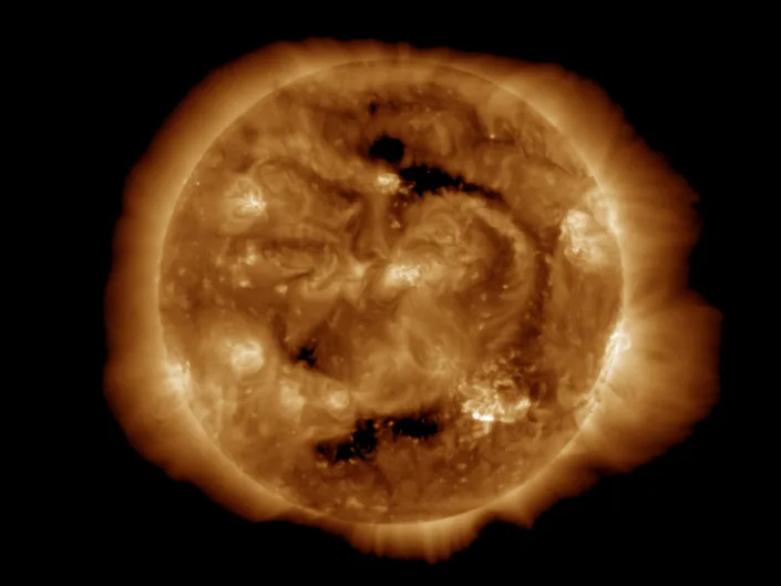 The sun with solar flares emanating from it.