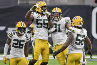 Green Bay Packers' Za'Darius Smith (55) and Preston Smith (91) celebrate as Will Redmond (25) and Rashan Gary (52) watch during the second half of an NFL football game against the Houston Texans Sunday, Oct. 25, 2020, in Houston. (AP Photo/Eric Christian Smith)