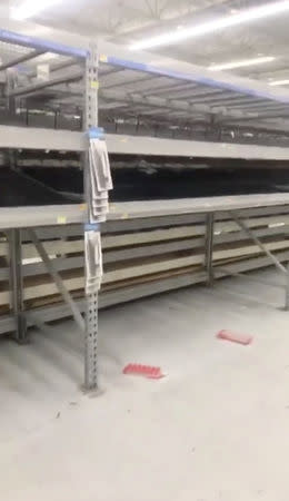 Empty shelves are seen at a supermarket as residents prepare for Storm Florence's descent in Columbia, South Carolina, U.S., September 10, 2018, in this still image taken from a video obtained from social media. @missgil/via REUTERS