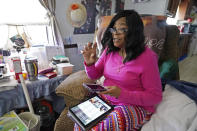 Mary Christian, 71, of McComb, Miss., recalls Friday, Jan. 15, 2021, the hours she spent on both her cell phone and iPad trying to arrange an appointment online for a COVID-19 vaccination through the Mississippi State Department of Health web site and on their listed registration phone line. Eventually, with help from one of her sons, she was able to enter the registration site only to find vaccination locations with openings were at least an hour's drive from the county she lives in and upon trying to sign up was informed they had no more openings. (AP Photo/Rogelio V. Solis)