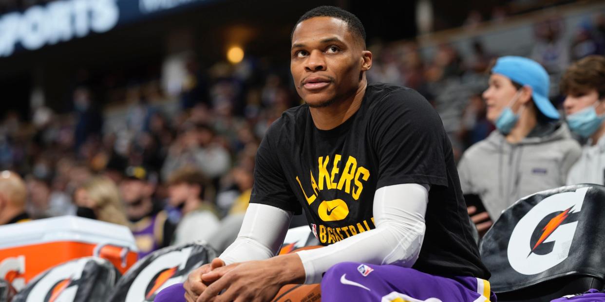 Russell Westbrook sits on the bench during a game in 2022.