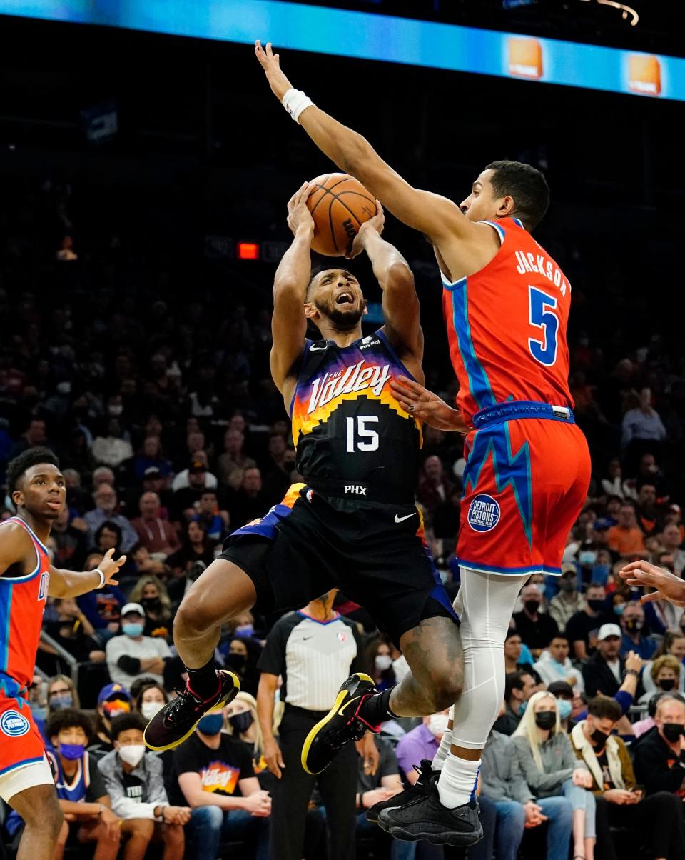 Dec 2, 2021; Phoenix, Arizona, USA; Phoenix Suns guard Cameron Payne (15) is pressured by Detroit Pistons guard Frank Jackson (5) at Footprint Center. Mandatory Credit: Rob Schumacher-Arizona Republic