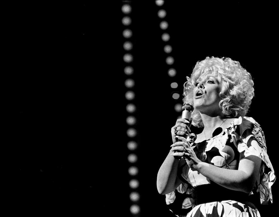 Dolly Parton performs before a packed audience during the 14th annual CMA Awards show at the Grand Ole Opry House Oct. 13, 1980.