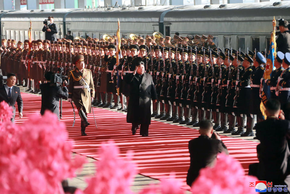 In this Saturday, Feb. 23, 2019, photo provided on Sunday, Feb. 24, 2019, by the North Korean government, North Korean leader Kim Jong Un salutes while reviewing troops at Pyongyang Station, North Korea, before leaving for Vietnam. Kim was on a train Sunday to Vietnam for his second summit with U.S. President Donald Trump, state media confirmed. Independent journalists were not given access to cover the event depicted in this image distributed by the North Korean government. The content of this image is as provided and cannot be independently verified. Korean language watermark on image as provided by source reads: "KCNA" which is the abbreviation for Korean Central News Agency. (Korean Central News Agency/Korea News Service via AP)