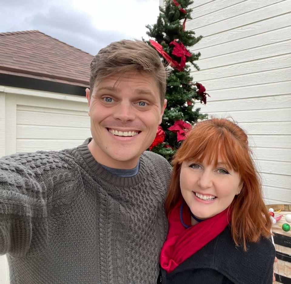 the author and her partner smiling