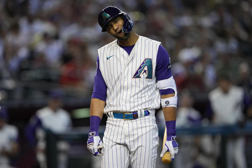 Arizona Diamondbacks' Lourdes Gurriel Jr. reacts to being called out on strikes during the first inning of a baseball game against the San Diego Padres, Saturday, Aug. 12, 2023, in Phoenix. (AP Photo/Matt York)