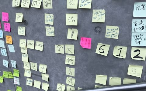 The sticky notes recreate the democracy wall that started during the 2014 protests  - Credit: Sophia Yan