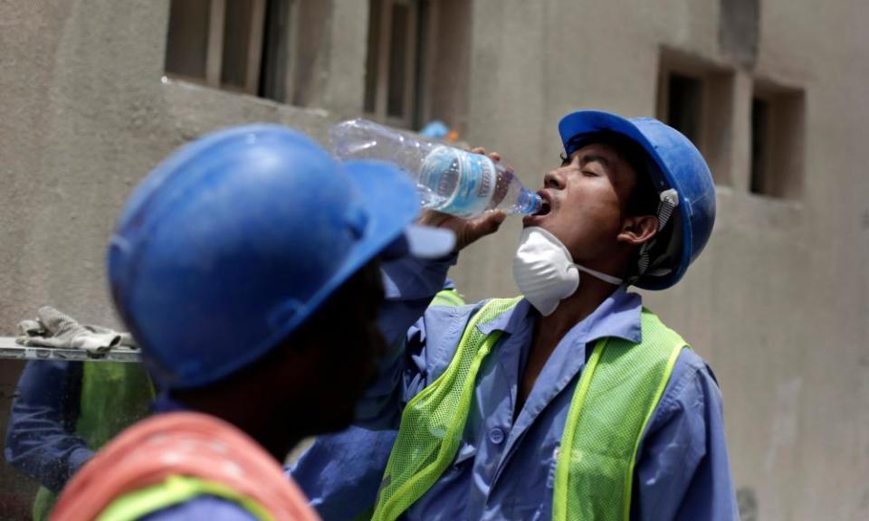 A 2015 photograph in Doha, Qatar, of a migrant worker from Nepal