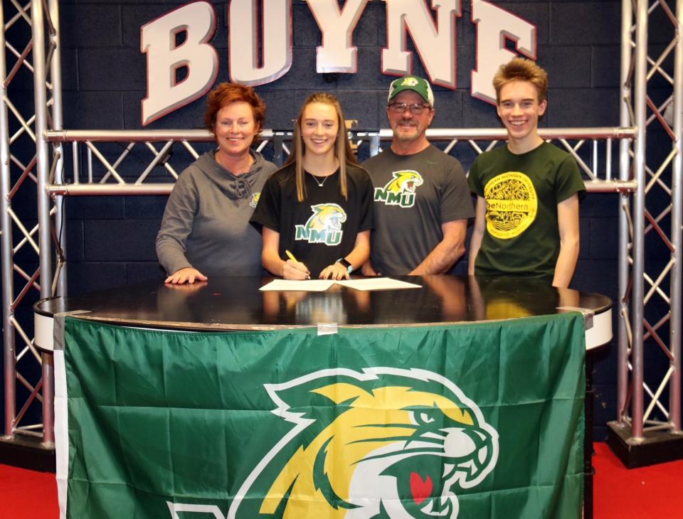 Boyne City senior Ava Maginity (second from left) recently signed with the Northern Michigan University women's cross country and track and field programs. She was joined by her mother, Lisa; father, Barry; and brother, Will.