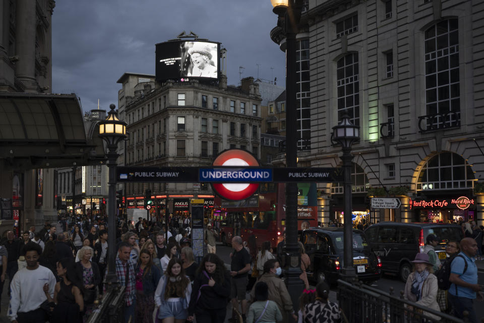 FILE - A giant screen atop a building displays a photo honoring the late Queen Elizabeth II at Piccadilly Circus in London, Saturday, Sept. 10, 2022. (AP Photo/Felipe Dana, File)