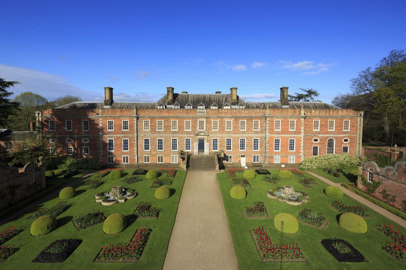 The 18th-century parterre garden and house at Erddig, Wrexham. The gardens contain rare fruit trees, a canal, a pond, a Victorian era parterre a national collection of ivy