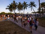 Crowds leave the beach during Spring Break in Miami Beach, Florida, on Saturday, March 18, 2023.