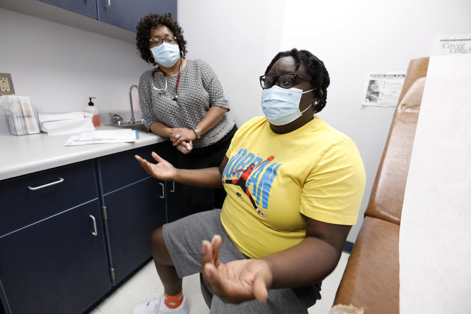 Ella McField, right, talks during an appointment with Dr. Janice Bacon, a primary care physician at Central Mississippi Health Services at the Community Health Care Center on the Tougaloo College campus, in Tougaloo, Miss., on Aug. 14, 2020. Ella, who is starting college this fall, says she’s wanted to be a doctor or a nurse since she was little because of Bacon. (AP Photo/Rogelio V. Solis)