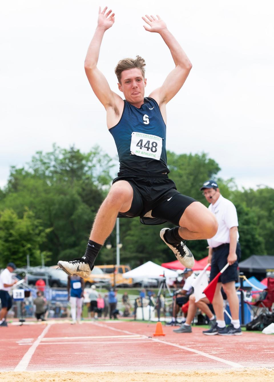 Seneca's Lee Hoover leaps through the air as he finishes with a sixth-place medal in the Class 2A triple jump at the PIAA track and field championships at Shippensburg University on Saturday