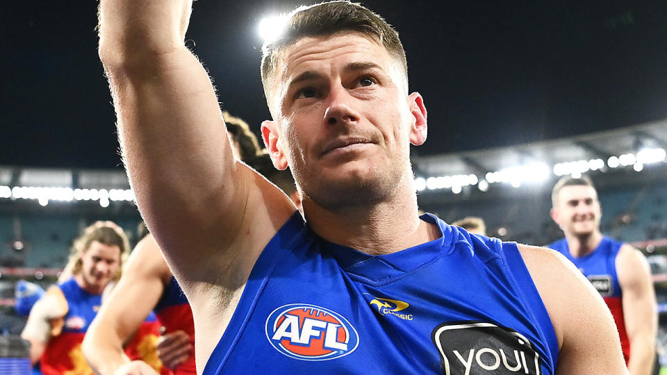 Dayne Zorko waves to Brisbane Lions fans as he walks off the ground.