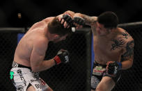 LAS VEGAS, NV - MAY 26: (R-L) Daniel Pineda punches Mike Brown during a featherweight bout at UFC 146 at MGM Grand Garden Arena on May 26, 2012 in Las Vegas, Nevada.