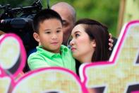 "Queen of All Media" Kris Aquino is seen at the float of the MMFF entry "Sisterekas" with son Bimby during the 2012 Metro Manila Film Festival Parade of Stars on 23 December 2012.(Angela Galia/NPPA Images)