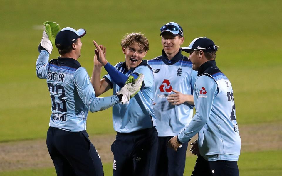 Sam Curran celebrating taking the wicket of Mitchell Starc - PA