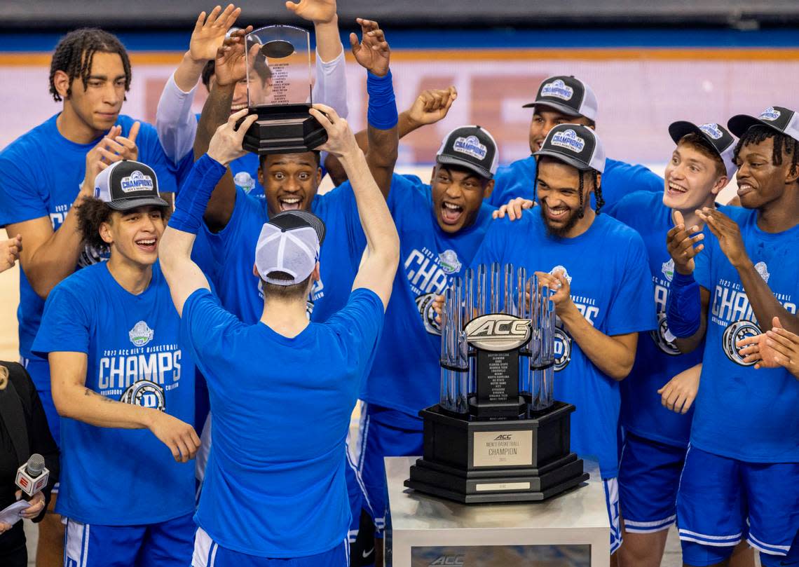 Duke’s Kyle Filipowski (30) celebrates with his teammates after being named the ACC Tournament MVP on Saturday, March 11, 2023 at the Greensboro Coliseum in Greensboro, N.C.