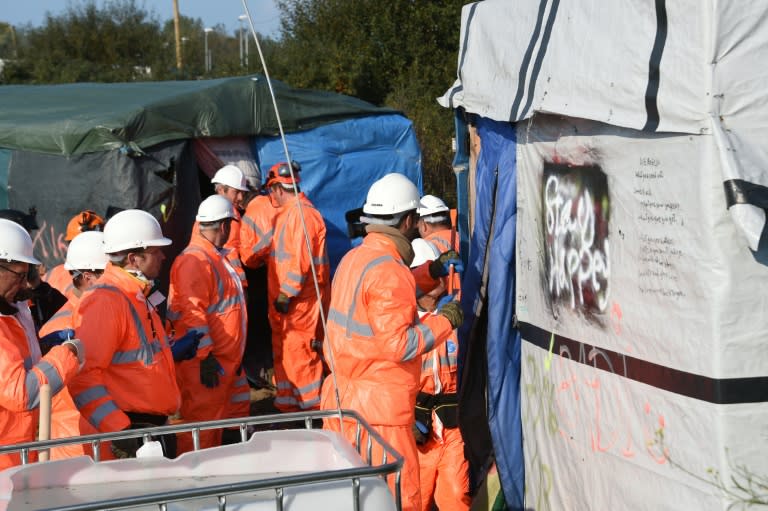 Workers begin the demolition of the "Jungle" migrant camp in northern France, on October 25, 2016