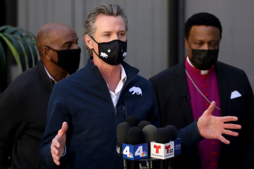 Governor Gavin Newsom addresses the media while visiting a mobile COVID-19 vaccination site in Inglewood.