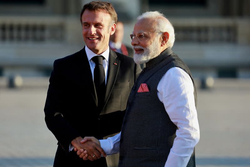 FILE PHOTO: French President Macron and Indian Prime Minister Modi arrive to a dinner held at the Louvre in Paris