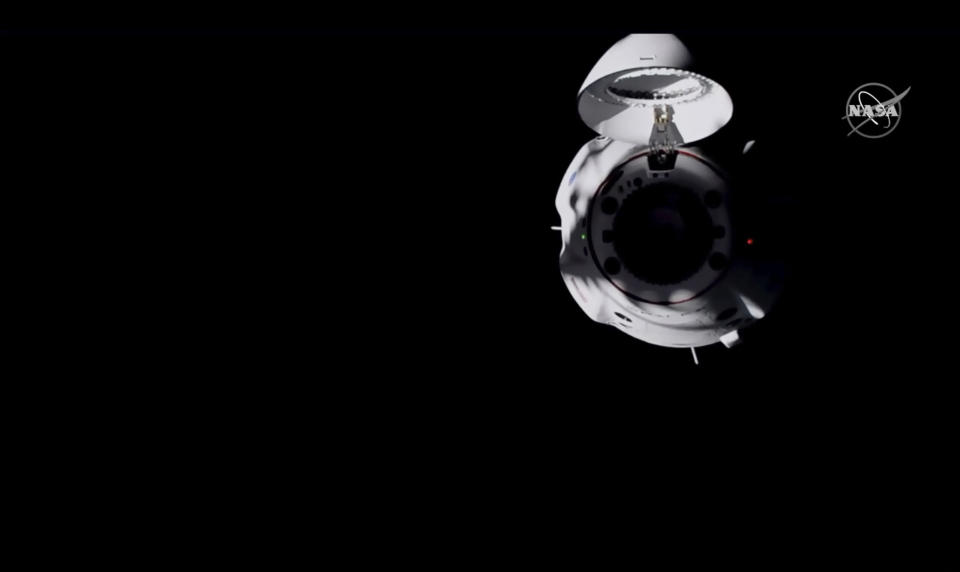 In this frame grab from NASA TV, the SpaceX Dragon capsule approaches the International Space Station, late Monday, Nov. 16, 2020. (NASA TV via AP)