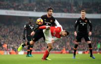 <p>Arsenal’s Francis Coquelin (right) and Hull City’s Andrea Ranocchia battle for the ball </p>