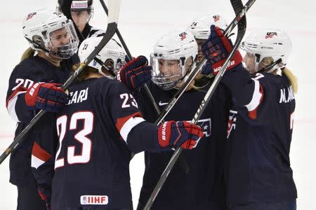 Jocelyne Lamoureux (C) of the U.S. celebrates her 1-0 goal with teammates during the 2015 IIHF Ice Hockey Women's World Championship group A match against Canada at the Malmo Isstadion in Malmo, southern Sweden, March 28, 2015. REUTERS/Claudio Bresciani/TT News Agency