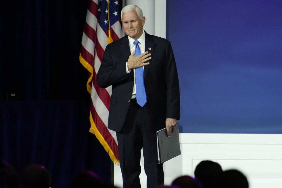 Former Vice President Mike Pence reacts as he walks on stage to speak at an annual leadership meeting of the Republican Jewish Coalition, Saturday, Oct. 28, 2023, in Las Vegas. Pence is dropping his bid for the Republican presidential nomination, ending his campaign for the White House. He said in Las Vegas that "after much prayer and deliberation, I have decided to suspend my campaign for president effective today." (AP Photo/John Locher)