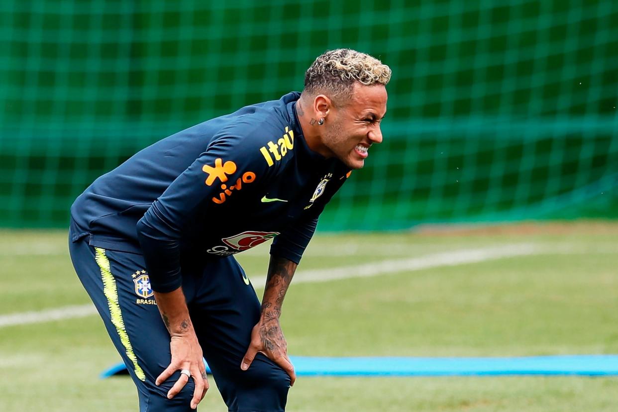 Limping: Neymar hobbled out of Brazil training in Sochi: EPA
