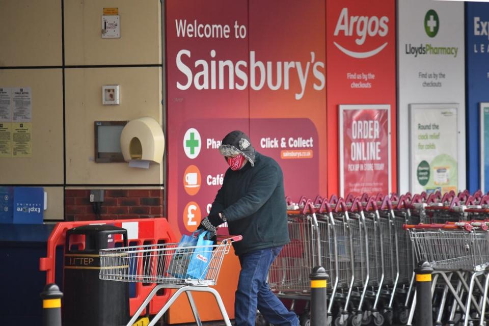 Sainsbury’s customer wearing face covering (PA Archive)