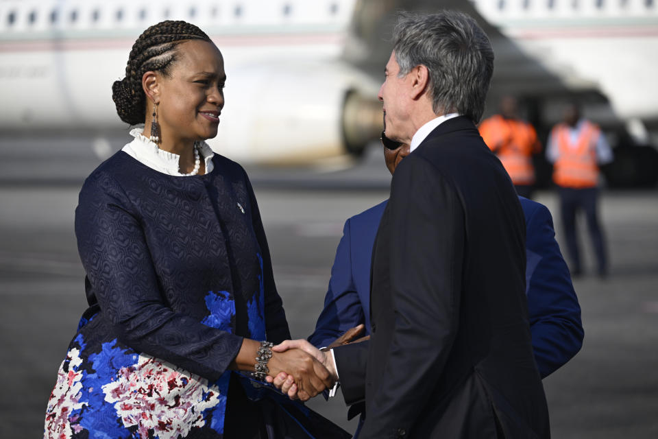 US Ambassador to Ivory Coast Jessica Davis Ba, left, welcomes US Secretary of State Antony Blinken at the Felix Houphouet-Boigny International Airport in Abidjan, Ivory Coast, Monday, Jan. 22, 2024. (Andrew Caballero-Reynolds/Pool Photo via AP)