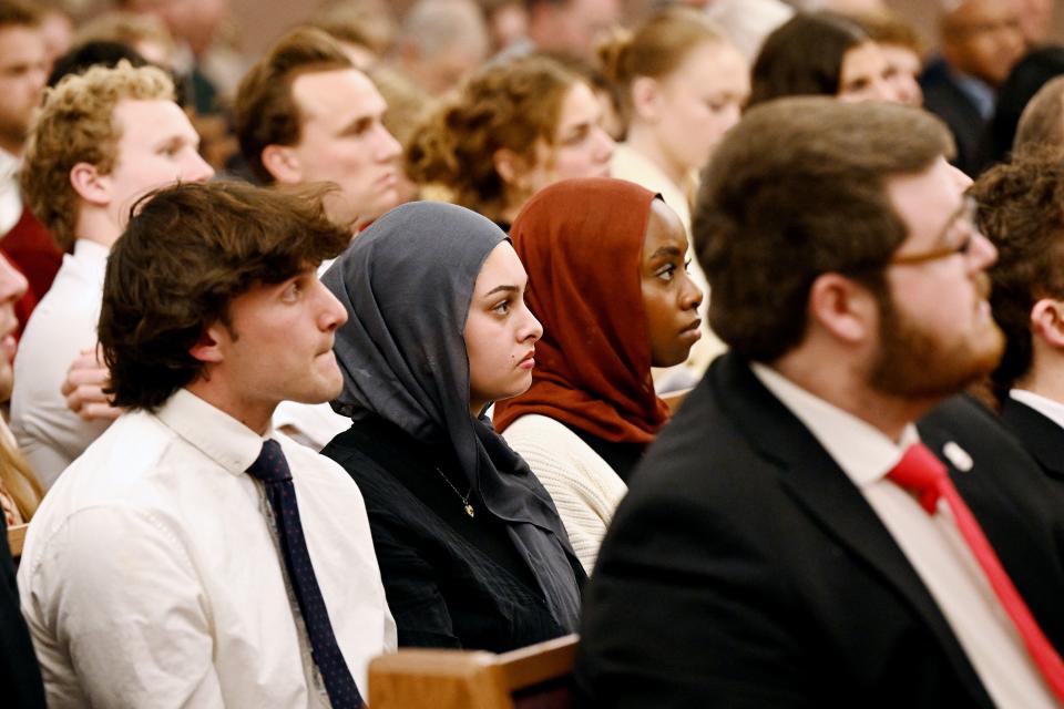 Crowd members listen to Eboo Patel as he speaks at a devotional at the Institute of Religion near the University of Utah in Salt Lake City.