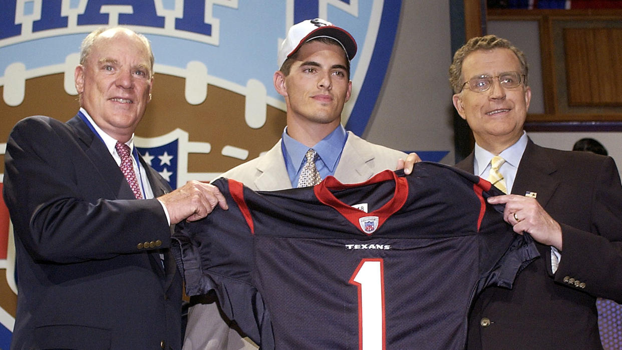 Mandatory Credit: Photo by Ed Betz/AP/Shutterstock (6032883a)MCNAIR CARR TAGLIABUE Houston Texans owner Bob McNair, left, and NFL Comissioner Paul Tagliabue, right, pose with quarterback David Carr, of Fresno State, the No.