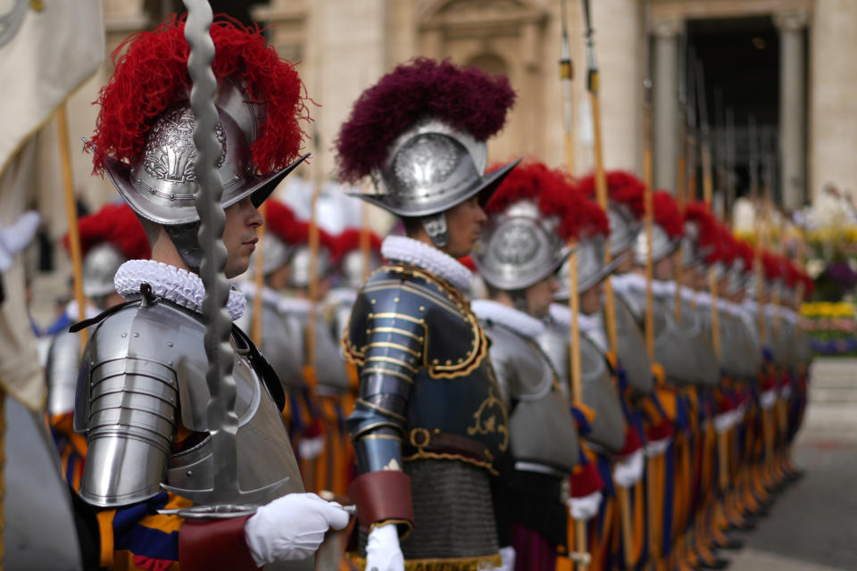 Vatican Swiss Guards arrive in St. Peter's Square at The Vatican where Pope Francis will celebrate the Easter Sunday mass, Sunday, March 31, 2024. (AP Photo/Andrew Medichini)