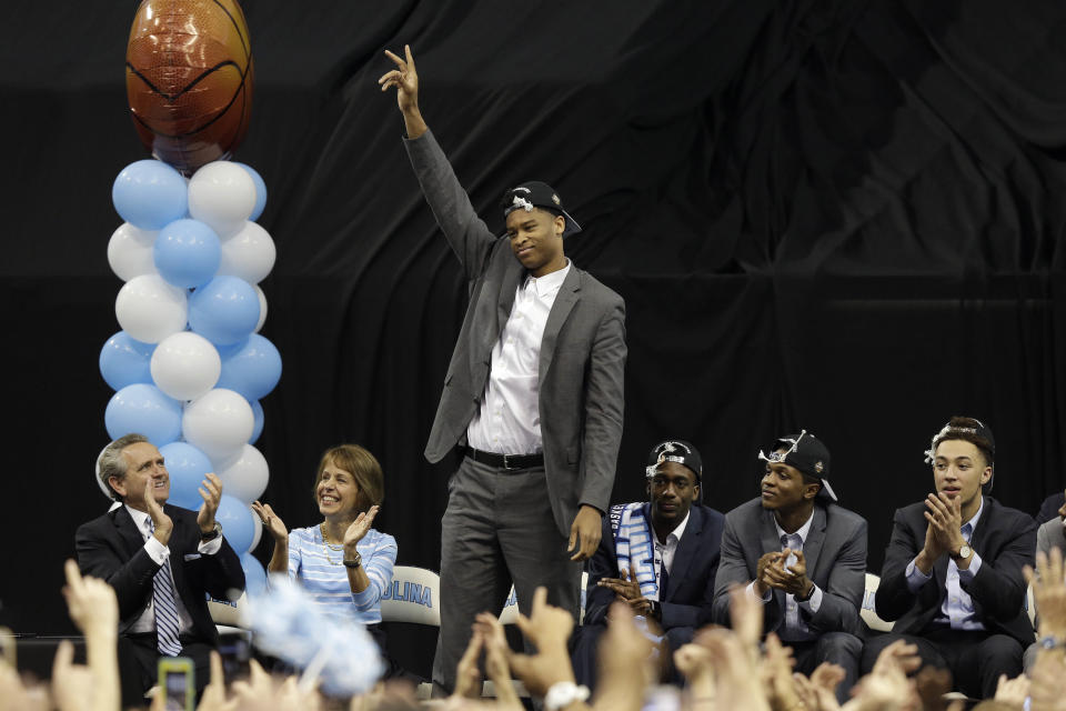 North Carolina's Isaiah Hicks waves as players and coaches greet fans in Chapel Hill, N.C., Tuesday, April 4, 2017 following Monday's win over Gonzaga in the NCAA college basketball championship. (AP Photo/Gerry Broome)