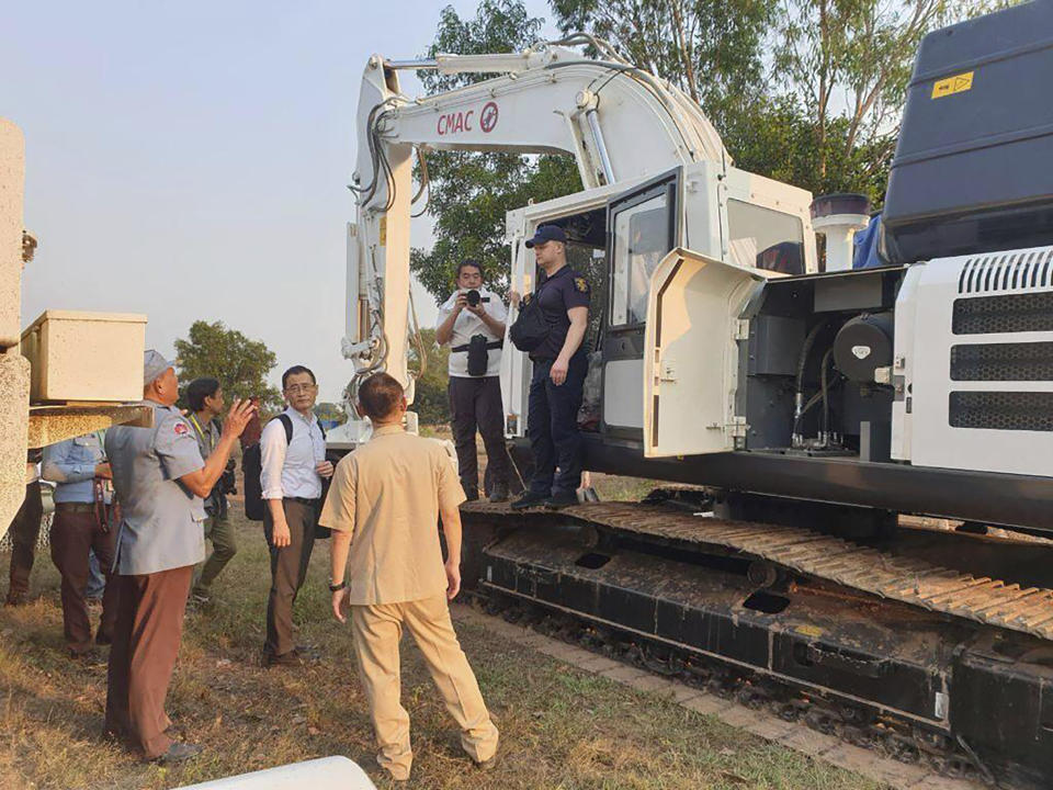 This photo released by the Cambodia Mine Action Center (CMAC), a Ukraine deminer at Mine Action Technical Institute in the central province, Cambodia, Monday, Jan. 16, 2023. Fifteen Ukrainian deminers are being trained by experts in Cambodia who are among the world's best because of experience from clearing the leftovers of nearly three decades of war. (Cambodia Mine Action Center via AP)