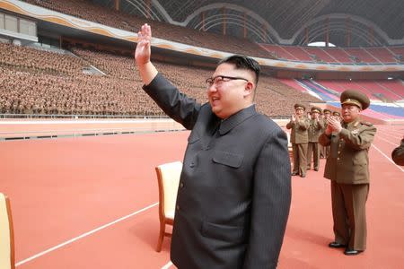 North Korean leader Kim Jong Un waves to the members of the Korean People's Army in this undated photo released by North Korea's Korean Central News Agency (KCNA) May 13, 2017. KCNA/via REUTERS