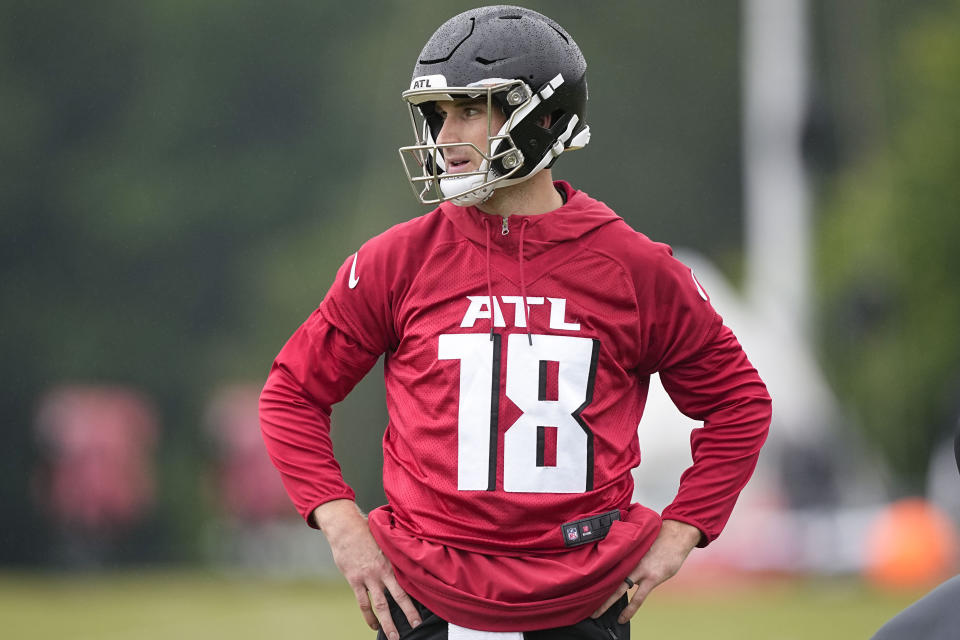 Atlanta Falcons quarterback Kirk Cousins runs drills during an NFL football mini training camp practice on Tuesday, May 14, 2024, in Flowery Branch, Ga. (AP Photo/Brynn Anderson)