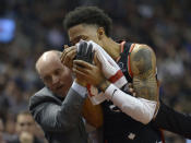 Toronto Raptors guard Patrick McCaw (22) leaves the court after an injury during the first half of an NBA basketball game against the Philadelphia 76ers, Wednesday, Jan. 22, 2020 in Toronto. (Nathan Denette/The Canadian Press via AP)