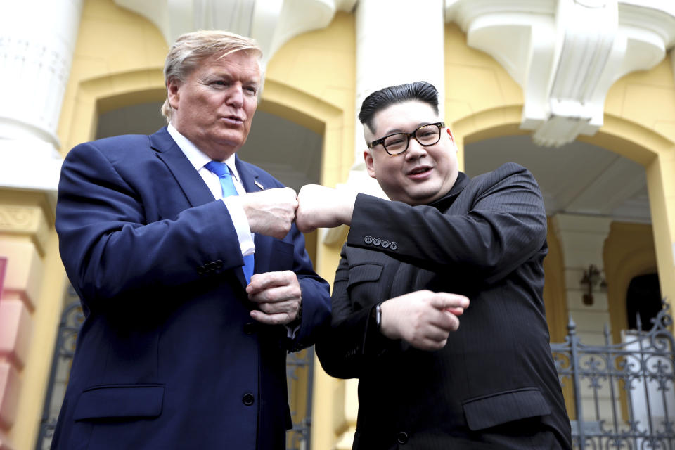 U.S. President Donald Trump impersonator Russell White, left, and Kim Jong-un impersonator Howard X pose for photos outside the Opera House in Hanoi, Vietnam, Friday, Feb. 22, 2019. The second summit between Trump and Kim will take place in Hanoi on Feb. 27 and 28. (AP Photo/Minh Hoang)