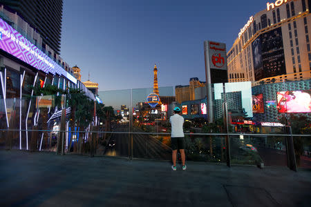 A tourist takes a picture above the Las Vegas Strip in Las Vegas, Nevada, U.S., August 27, 2018. Picture taken August 27, 2018. REUTERS/Mike Blake